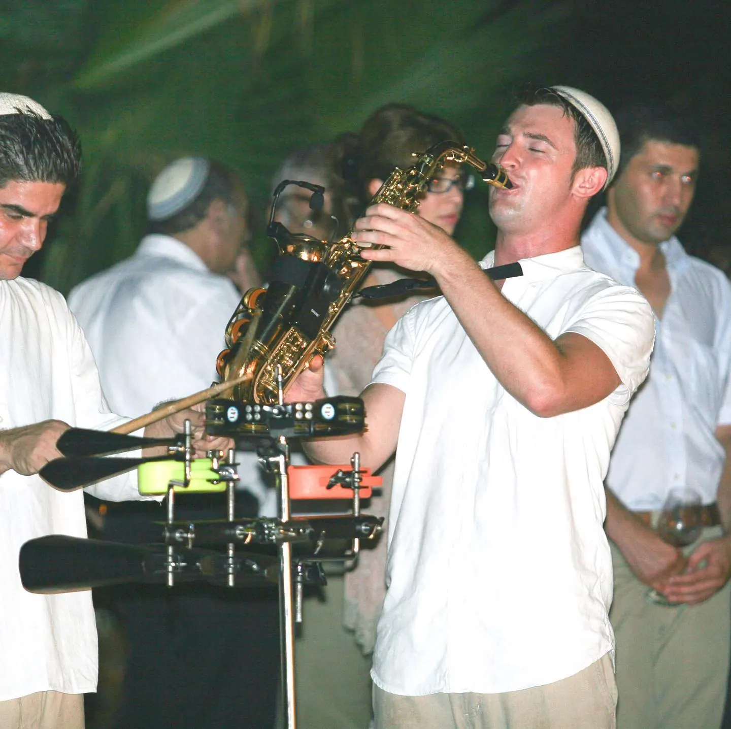 George Kash playing saxophone at a Jewish wedding